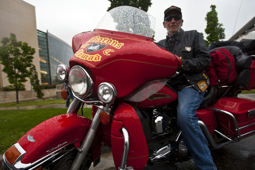 Chris Detrick  |  The Salt Lake Tribune
Ralph "Teach" Elrod sits on his Harley-Davidson 2003 Firefighter Special Edition outside the Salt Lake City Public Library on Tuesday. Elrod wrote the book "Kick Start: Memories of an Outlaw Biker."