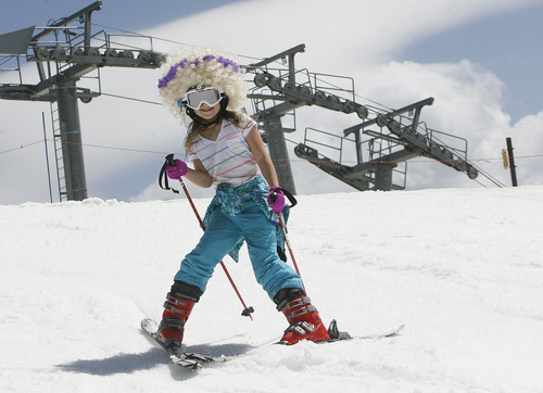 Scott Sommerdorf   |  The Salt Lake Tribune
A young skier stops to pose for a phot after getting off the tram on the last day of skiing at Snowbird Resort, Monday May 27, 2013.