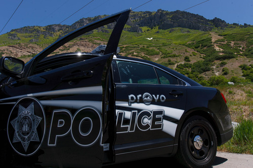 Trent Nelson  |  The Salt Lake Tribune
A Provo police cruiser blocks the road at the Y Mountain trailhead, where a search for a missing hiker continued Tuesday June 4, 2013 in Provo.