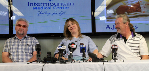 Rick Egan  | The Salt Lake Tribune 

L-R Jim Gerber, Lynnete Hales (center) Jeffrey Hales (right) discuss the twins that were born on I-80 yesterday morning, during a press conference Monday, June 3, 2013.