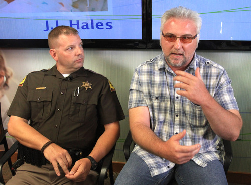 Rick Egan  | The Salt Lake Tribune 

Cameran Rawson (left) listens as Jim Gerber (right) talks about delivering the first of the two twins on the freeway yesterday morning.  Monday June 3, 2013.