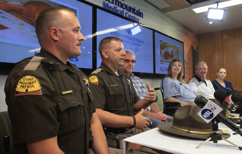 Rick Egan  | The Salt Lake Tribune 

Highway Patrol Troopers, Nathan Powell and Cameron Rawson talks about their  part in delivering the Hale's twins during a press conference Monday, June 3, 2013.