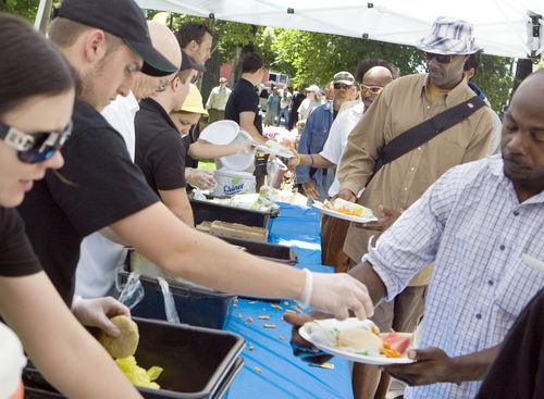 Keith Johnson | The Salt Lake Tribune

Subway employees serve meals to some of the 1,100 people that came to Pioneer Park for "Day of Giving." Subway donated all the meals as well as $10,000 to the Rescue Mission of Salt Lake in Salt Lake City, June 5, 2013.