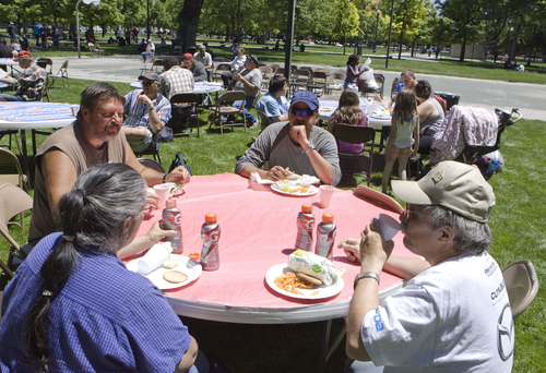 Keith Johnson | The Salt Lake Tribune

Joyce and Phil Scherrer (front) and Robert and Shane Schuessler eat lunch at Pioneer Park in Salt Lake City June 5, 2013, during "Day of Giving" where Subway Restaurants of Utah served 1,100 meals and donated $10,000 to the Rescue Mission of Salt Lake.