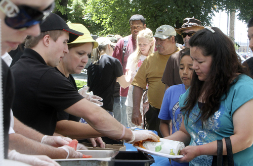 Keith Johnson | The Salt Lake Tribune

Subway employees serve meals to some of the 1,100 people that came to Pioneer Park for "Day of Giving" in Salt Lake City, June 5, 2013. Subway donated all the meals as well as $10,000 to the Rescue Mission of Salt Lake.