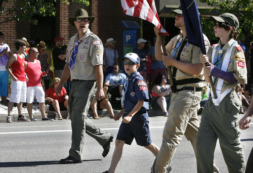 Scott Sommerdorf   |  The Salt Lake Tribune
Scoutmaster Dave McGrath leads a small contingent of Boy Scouts and Cub Scouts at the front of the Utah Pride Parade as they move through the streets of downtown Salt Lake City, Sunday, June 2, 2013.