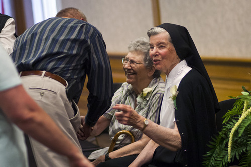 Chris Detrick  |  The Salt Lake Tribune
Sister Jean Gibson and Sister Luke Hoschette talk with friends during an open house-farewell for the Sisters of St. Benedict at Ogden Regional Medical Center on Tuesday, June 4, 2013. The sisters are returning to St. Benedict's Monastery in St. Joseph, Minn., to continue with their lives of service. "We leave with no regrets," said Sister Stephanie Mongeon. "We leave our peace and gratitude with the people of this community."