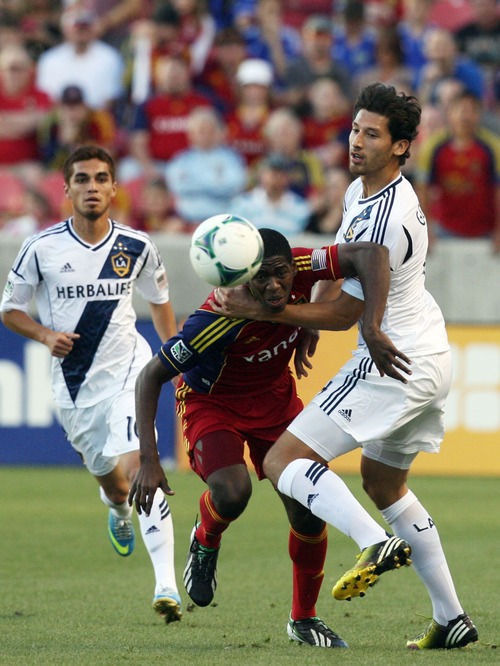 Kim Raff  |  The Salt Lake Tribune
(left) Real Salt Lake forward Olmes Garcia (13) tries to get past (right) Los Angeles Galaxy defender Omar Gonzalez (4) during the first half at Rio Tinto in Sandy on April 27, 2013.