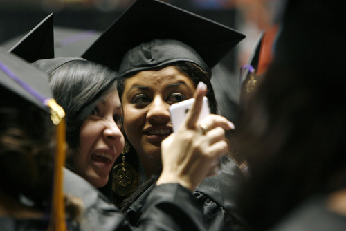 Francisco Kjolseth  |  The Salt Lake Tribune
Stefany Hernandez, left, and Anahi Huerta look for friends and family gathered for their graduation from Horizonte High during ceremonies at the Huntsman Center on the University of Utah campus on Wednesday, June 5, 2013.