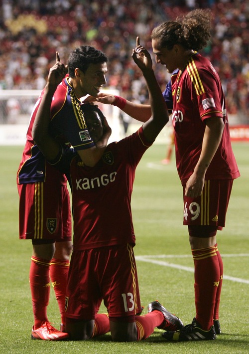 Kim Raff  |  The Salt Lake Tribune
(middle) Real Salt Lake forward Olmes Garcia (13) celebrates scoring his second goal against the Los Angeles Galaxy with teammates (left) Real Salt Lake midfielder Javier Morales (11) and (right) Real Salt Lake forward Devon Sandoval (49) during the second half at Rio Tinto Stadium in Salt Lake City on June 8, 2013.  Real went on to win the game 3-1.