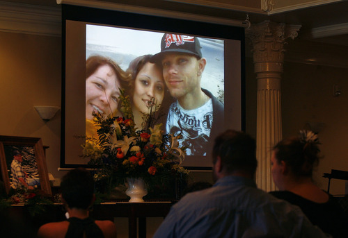 Scott Sommerdorf   |  The Salt Lake Tribune
A slide show of photos and videos of Daniel Kooyman plays at his funeral. Kooyman, who grew up in Utah, committed suicide on June 1 at his home in Cut Bank, Mont. The photo shows him with his mother, Suzette Kooyman, and his girlfriend, Tina Trombley.