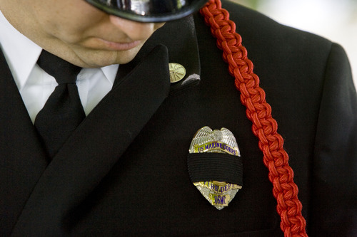 Kim Raff  |  The Salt Lake Tribune
Salt Lake City Fire Department Honor Guard member John Stevens gets ready to participate in a memorial service for Salt Lake City firefighter Lt. Paul Hamilton who was fatally injured 70 years ago while battling a hotel fire on a 100-foot ladder when the ladder collapsed at this spot on 400 South Main Street in Salt Lake City on June 10, 2013.