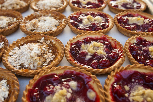 Chris Detrick  |  The Salt Lake Tribune
Dutch apple and cherry tarts from Pierre Country Bakery for sale at the Downtown Salt Lake City Farmers Market in Pioneer Park Saturday June 8, 2013.