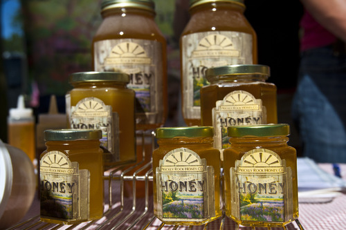 Chris Detrick  |  The Salt Lake Tribune
Wildflower honey from Prickly Rock Honey for sale at the Downtown Salt Lake City Farmers Market in Pioneer Park Saturday June 8, 2013.