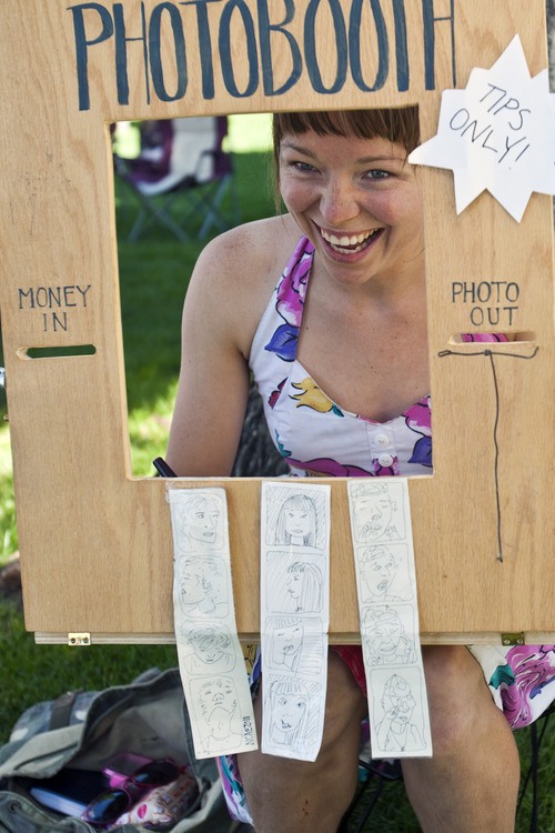 Chris Detrick  |  The Salt Lake Tribune
Natalie Allsup-Edwards hand draws portraits at her photo booth at the Downtown Salt Lake City Farmers Market in Pioneer Park Saturday June 8, 2013.