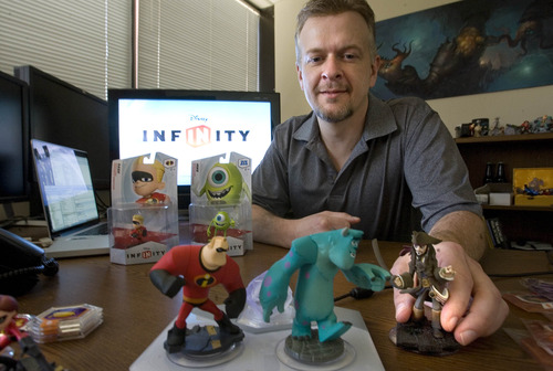 Paul Fraughton  |  The Salt Lake Tribune
John Blackburn of Avalanche Software shows off some of the characters from their new game "Disney Infinity," which they hope will make a big splash at next week's video game trade show.          Thursday, June 6, 2013