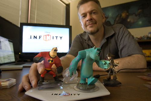Paul Fraughton  |  The Salt Lake Tribune
John Blackburn of Avalanche Software shows off some of the characters from their new game "Disney Infinity," which they hope will make a big splash at next week's video game trade show.          Thursday, June 6, 2013
