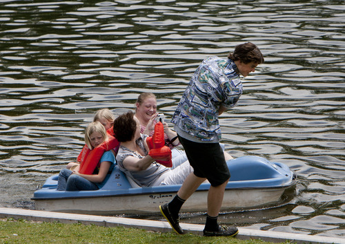 Steve Griffin | The Salt Lake Tribune


Megan Hill laughs as she takes a video of paddle boat operator, William Morgan, as he pulls their boat back to the dock after high winds pushed them to the far side of the Liberty Park pond in Salt Lake City, Utah Monday June 10, 2013. Hill was joined in the vessel by Liz Leary and her daughters Brinnley and Karli. The boats can be rented at the pond.