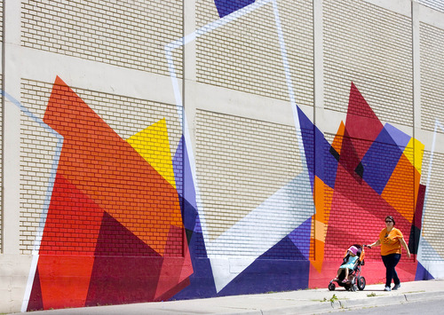 Paul Fraughton  |  The Salt Lake Tribune
A freshly painted mural on the side of the former Sugar House Desert Industries location creates a colorful background for passersby.                          
 Tuesday, June 11, 2013