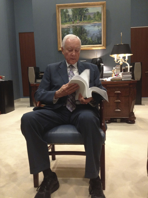 Matt Canham | Tribune file photo
Sen. Orrin Hatch flips through the 844-page immigration reform bill in his Senate Office. He said fixing the immigration problem is "crucial."