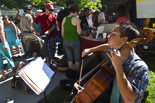 Chris Detrick  |  The Salt Lake Tribune
Xavier Humberg, 16, of West Valley CIty, plays his cello at the Downtown Salt Lake City Farmers Market in Pioneer Park Saturday June 8, 2013.