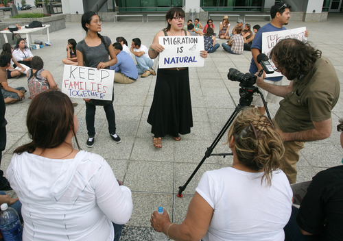 Rick Egan  | The Salt Lake Tribune 

Janeth (left) and Daniela Cobian (right) join the vigil at the federal building, Wednesday, June 12, 2013. Immigrant youth with the Salt Lake Dream Team and community leaders launched a nightly vigil outside Sen. Orrin Hatch's federal building office to push the Senator to champion immigration reform.