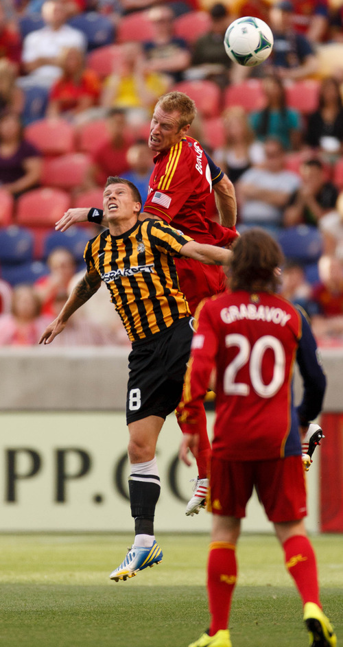 Trent Nelson  |  The Salt Lake Tribune
Real Salt Lake's Nat Borchers heads the ball over Charleston's Nicki Paterson as Real Salt Lake hosts Charleston Battery in the US Open Cup Wednesday June 12, 2013 at Rio Tinto Stadium in Sandy, Utah.