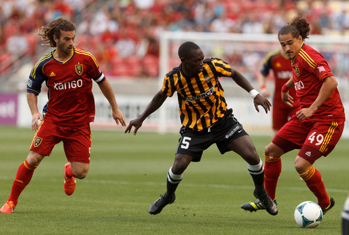 Trent Nelson  |  The Salt Lake Tribune
Charleston's Micheal Azira in between Real Salt Lake's Kyle Beckerman and Devon Sandoval as Real Salt Lake hosts Charleston Battery in the US Open Cup Wednesday June 12, 2013 at Rio Tinto Stadium in Sandy, Utah.