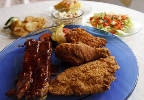 Leah Hogsten  |  The Salt Lake Tribune
 Dish of the Week:  Mama's Southern Plantation full combo plate of fried chicken, fried catfish and ribs, served with fried potatoes, coleslaw, cornbread and a salad in Midvale, Wednesday, May 29, 2013.