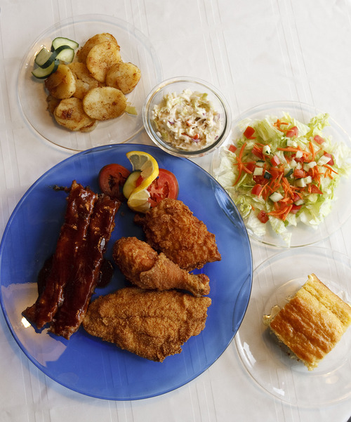 Leah Hogsten  |  The Salt Lake Tribune
 Dish of the Week:  Mama's Southern Plantation full combo plate of fried chicken, fried catfish and ribs, served with fried potatoes, coleslaw, cornbread and a salad in Midvale, Wednesday, May 29, 2013.