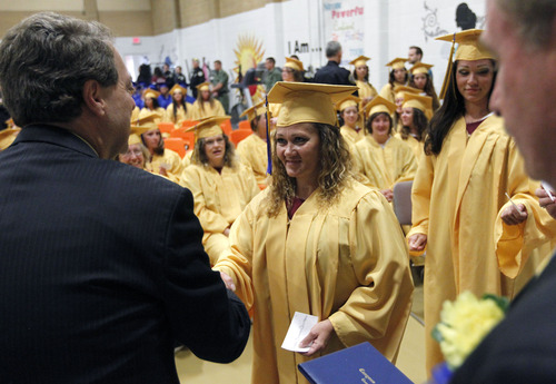Al Hartmann  |  The Salt Lake Tribune
Women inmates receive congratulations and their high school diploma at the Utah State Prison in Draper Wednesday June 11. A record-high 360 men and women inmates graduated with high school diplomas and celebrated an important milestone on their paths toward returning to the community as law-abiding citizens. Another 140 inmates will likewise walk in a commencement ceremony at the Central Utah Correctional Facility in Gunnison on June 19.