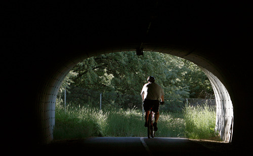Steve Griffin | The Salt Lake Tribune
A biker rides through a tunnel under 10000 South on the Jordan River Parkway in Sandy Wednesday June 5, 2013.
