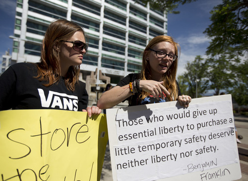Lennie Mahler  |  The Salt Lake Tribune
Ashley Shaw and Macey Booth speak out against PRISM, an NSA program which gathers and stores phone and internet data without user permission. The protest attracted six people in front of the Wallace Bennett Federal Building in Salt Lake City, Friday, June 14, 2013.