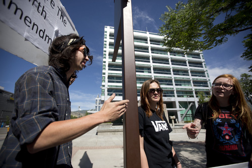 Lennie Mahler  |  The Salt Lake Tribune
Nicholas Shaw, Ashley Shaw, and Macey Booth speak out against PRISM, an NSA program which gathers and stores phone and internet data without user permission. The protest attracted six people in front of the Wallace Bennett Federal Building in Salt Lake City, Friday, June 14, 2013.