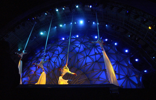 Steve Griffin  |  Tribune file photo

Against the backdrop of the Hoberman Arch, acrobats slide down long pieces of material onto the stage at the Olympic Medals Plaza during the 2002 Winter Games.