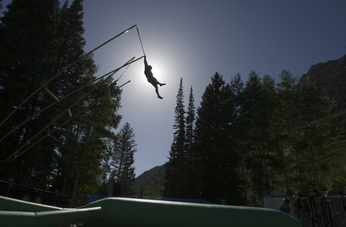 Rick Egan  | The Salt Lake Tribune 

Seven-year-old Koah Wilson, enjoys a ride on the Air Jumper, during the Father's Day BBQ  and Brewfest at Snowbird, Sunday, June 16, 2013.