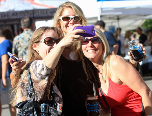 Rick Egan  | The Salt Lake Tribune 

L-R Aimee Sykes, Judi Lehrman, and Kim Jessing snap a photo of themselves on their phone to remember the good times they are having at the Father's Day BBQ  and Brewfest at Snowbird, Sunday, June 16, 2013.