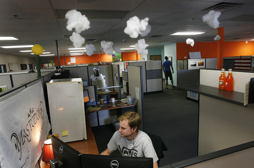 Scott Sommerdorf   |  The Salt Lake Tribune
Logan Robins, SEO strategist at OrangeSoda in American Fork and his pod mates took it upon themselves to decorate their section of OrangeSoda with cotton clouds that allude to their cloud-based work, Wednesday, June 5, 2013. Thirty-five percent of all jobs created in Utah since 2010 have been created between 10600 South in Salt Lake County and Provo/Orem. Most have been high technology jobs like the ones at OrangeSoda which has about 200 employees.