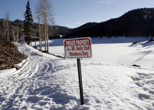 A sign for the Mt. Holly Club sits at Puffer Lake in the Tushar Mountains above Beaver on March 15, 2007. Attorneys for imprisoned businessman Marc Sessions Jenson allege then-Attorney General Mark Shurtleff and current Attorney General John Swallow tried to "shake down" Jenson for a stake in the development of Mt. Holly Club. The property is now operated as Ealge Point resort under different ownership Photo by Al Hartmann/Salt Lake Tribune