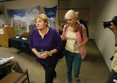Francisco Kjolseth  |  The Salt Lake Tribune
Tara Evans, left, leaves a press conference alongside her daughter Karen Evans at the McKay-Dee Hospital Center in Ogden on Monday, June 17, 2013, following an update on the condition of her husband James Evans who was shot in the head during church services on Sunday.