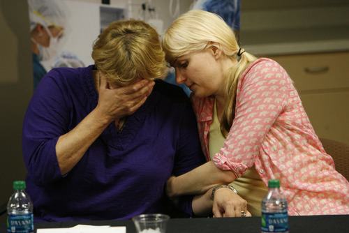 Francisco Kjolseth  |  The Salt Lake Tribune
Tara Evans, left, is comforted by her daughter Karen Evans during a press conference at the McKay-Dee Hospital Center in Ogden on Monday, June 17, 2013, during an update on the condition of her husband James Evans who was shot in the head during church services on Sunday.