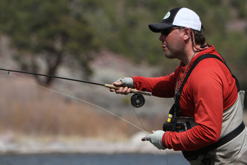 Francisco Kjolseth  |  The Salt Lake Tribune
Darren Bowcutt, head river guide for Western Rivers Fly Fisher, tries for perfect placement in hopes of attracting a fish from the shores of the Green River in April of 2013.