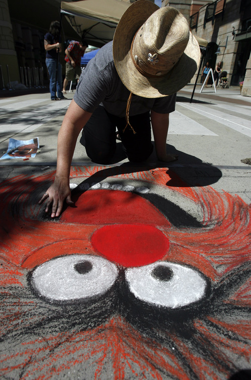 Rick Egan  |  The Salt Lake Tribune
Kris Herschbeck draws "Animal" at the Utah Foster Care Foundation's Annual Chalk Art Festival, at The Gateway in Salt Lake City, Friday, June 15, 2012. The festival continues through Saturday.