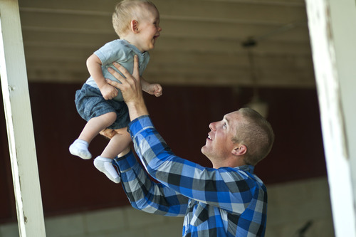 Chris Detrick  |  The Salt Lake Tribune
Jason Call plays with his son Corver in Delta Tuesday June 11, 2013. Corver was born 10 months ago while Jason was serving in Afghanistan with Utah Army National Guard's 624th Engineer Company.