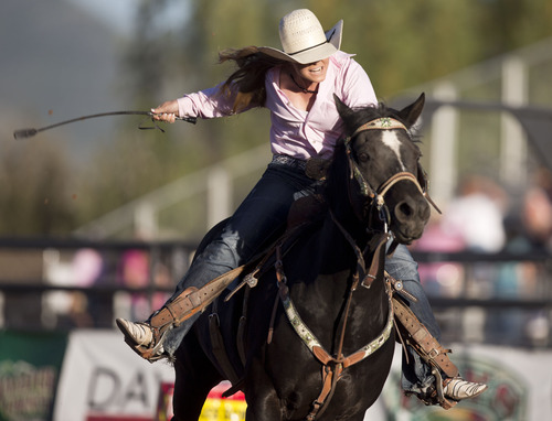 Lennie Mahler  |  The Salt Lake Tribune
Shayla Giles scores a 17.177 in the barrel racing event in the Utah High School Rodeo Championships in Heber City, Utah, Friday, June 14, 2013.