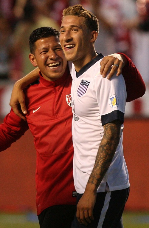 Leah Hogsten  |  The Salt Lake Tribune
Nick Rimando (22) and Fabian Johnson (23) of the U.S. celebrate the win with his teammates as they walk the field thanking the sold out crowd. USA defeated Honduras 1-0 at the half during their World Cup soccer qualifying rematch Tuesday, June 18, 2013 at Rio Tinto Stadium.