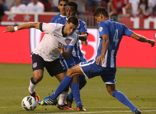Leah Hogsten  |  The Salt Lake Tribune
Clint Dempsey (8) of the U.S. tries to round Honduras' Juan Pablo Montes (4). USA defeated Honduras 1-0 at the half during their World Cup soccer qualifying rematch Tuesday, June 18, 2013 at Rio Tinto Stadium.