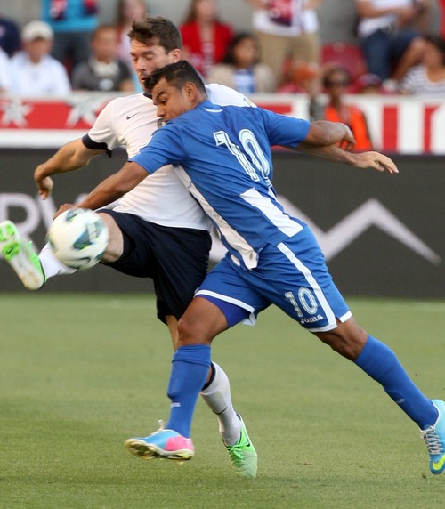 Leah Hogsten  |  The Salt Lake Tribune
Brad Evans (6) of the U.S. battles with Honduras' Mario Martinez (10). USA defeated Honduras 1-0 at the half during their World Cup soccer qualifying rematch Tuesday, June 18, 2013 at Rio Tinto Stadium.