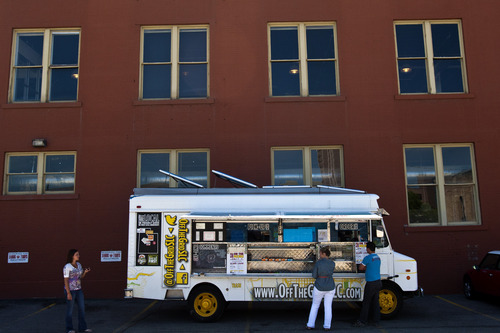 Chris Detrick  |  The Salt Lake Tribune
Customers order food from Off the Grid's food truck parked near 200 South and 200 West Wednesday June 5, 2013.