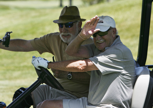 Francisco Kjolseth  |  The Salt Lake Tribune
Julius Nuckolas, left, and Bill Irvine finish up a round with friends at the Mick Riley Golf Course in Murray on Wednesday, June 19, 2013. The golf course popular with kids and seniors could be facing closure because the Salt Lake City Water Department, which owns most of the property, is increasing the rent to reflect the value of the land, needing that revenue to fund its operations. The county, which operates the course, has negotiated a five-year lease with the city to try to find a permanent solution -- including possible closure.